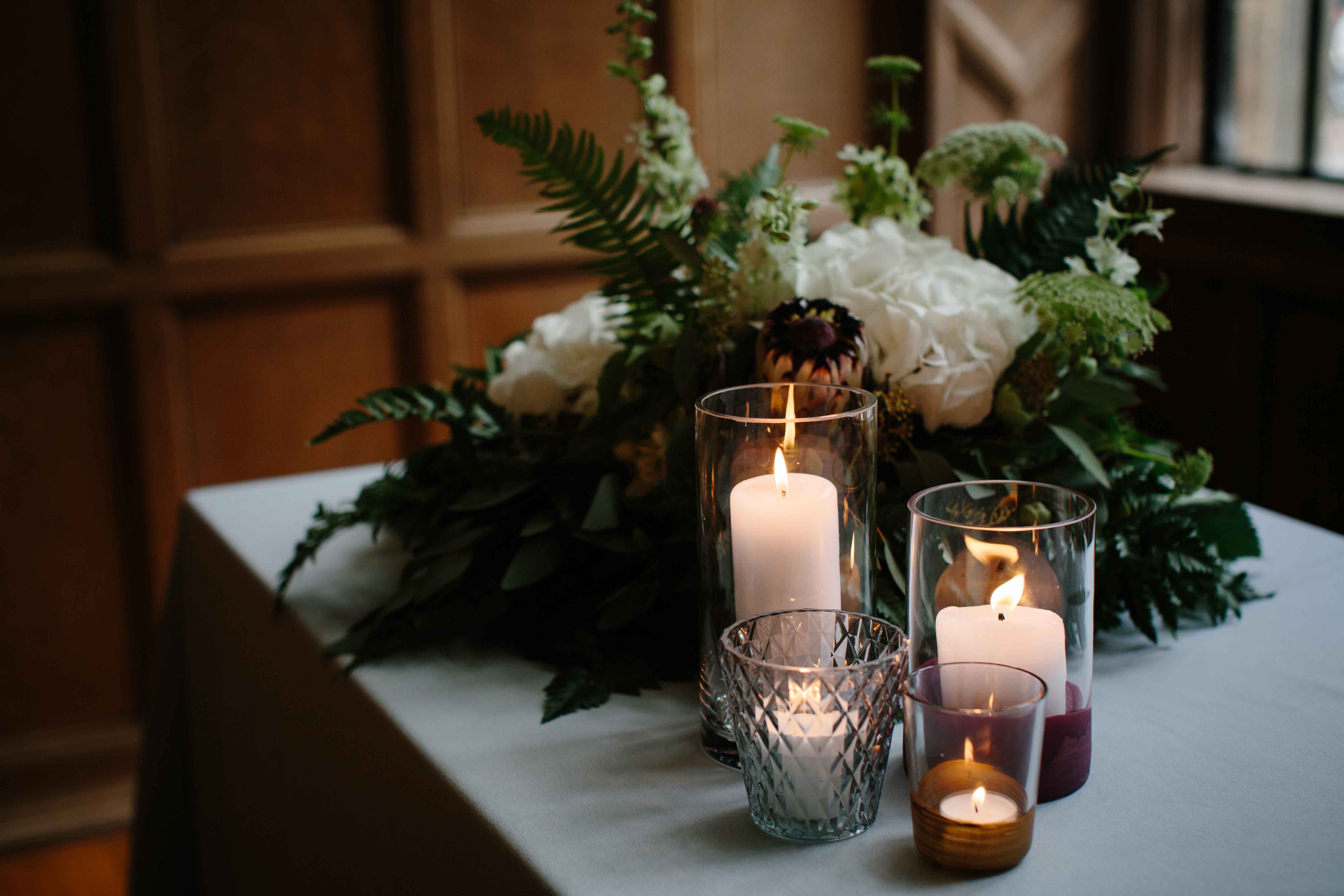 Registrar flowers with candles.