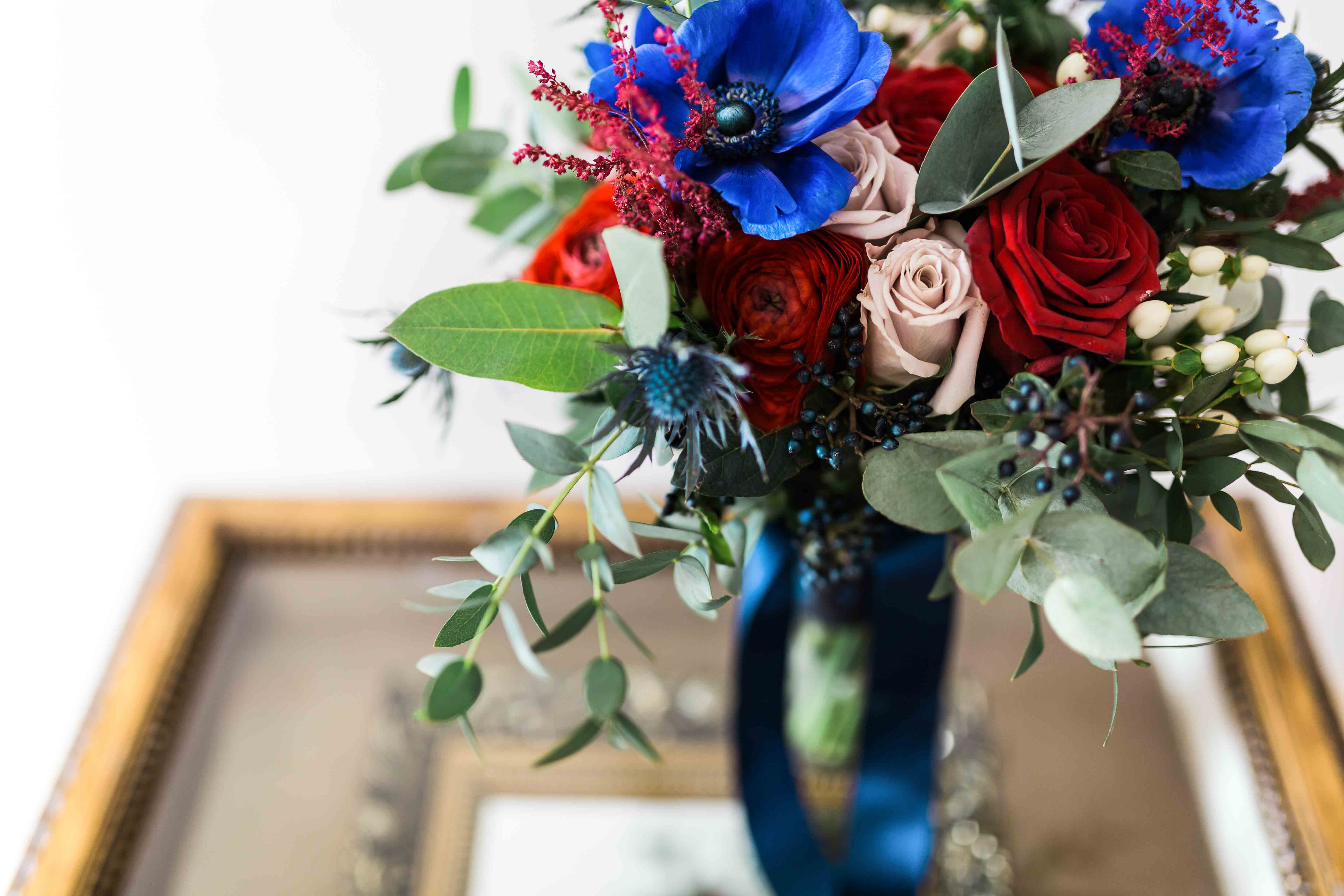 Bouquet of pink, red and navy flowers.